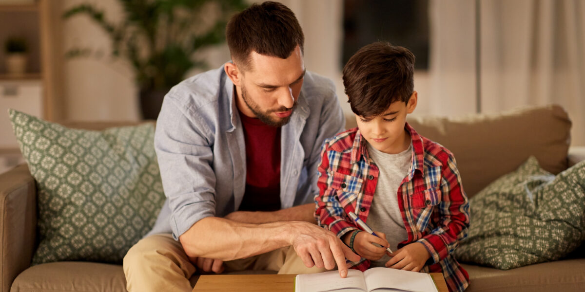 Father and son working together on homework
